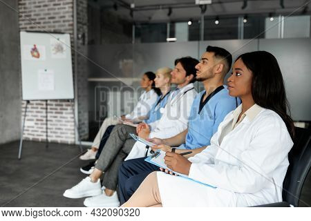 Professional Multiethnic Group Of Healthcare Employees Having Medical Conference