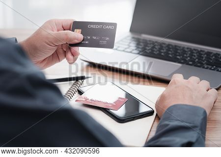 Businessman Make Online Banking, Making A Payment Or Purchasing On The Internet Entering His Credit 