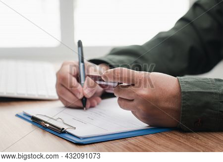 Businessman Hold Credit Card In Hand For Make Online Banking, Making A Payment Or Purchasing On The 