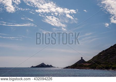 The Genoese Tower And Lighthouse Of Les Iles Sanguinaires Near Ajaccio In Corsica Silhouetted Agains
