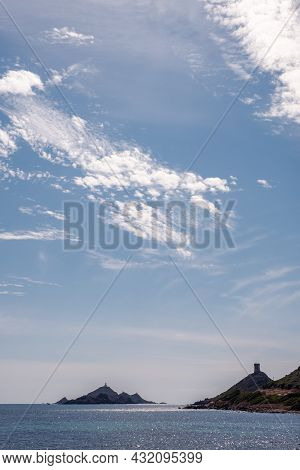 The Genoese Tower And Lighthouse Of Les Iles Sanguinaires Near Ajaccio In Corsica Silhouetted Agains