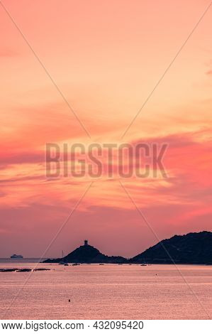 A Ferry Passes The Genoese Tower At The Pointe De Parata In Les Iles Sanguinaires Near Ajaccio In Co