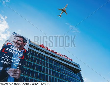 Lisbon, Portugal - Feb 8, 2018: Klm Plane Flying Above The Santander Totta Bank Headquarter Building