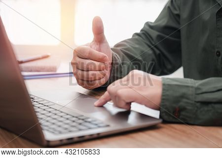 Business Man Thumbs Up For Work On The Project Successfully Using Computer And Writing On A Paper On