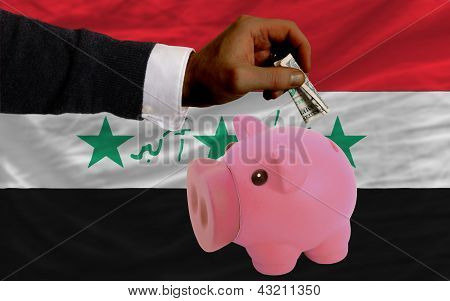 Dollar Into Piggy Rich Bank And  National Flag Of Iraq