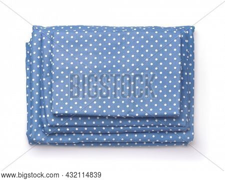Top view of folded blue cotton bedding set isolated on white