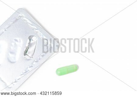 Green Chiretta Herbal Capsule On White Background With Copy Space For Healthcare And Medical Concept