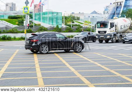 Infiniti Qx70 Second Generation Driving On City Street. Side View Of Premium Black Suv. Moscow, Russ