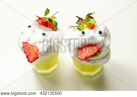 Egg Liqueur In Shot Glass Decorated With Fluffy Whipped Cream And Pieces Of Strawberry, Served In Fu