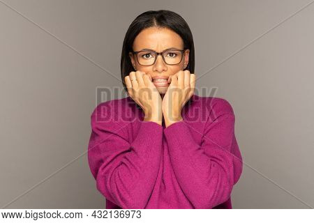 Frightened African American Female Holding Folded Hands Together Look Scared And Shocked. Desperate 
