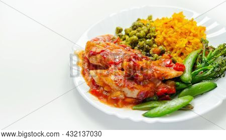 Chicken Breast In A Tomato And Red Pepper Sauce With Spiced Long Grain Rice And Crushed Minted Peas