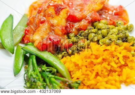 Chicken Breast In A Tomato And Red Pepper Sauce With Spiced Long Grain Rice And Crushed Minted Peas,