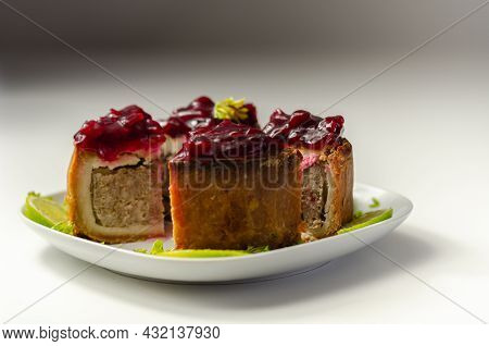 Seasoned British Pork, Wrapped In Crisp, Flavoursome Pastry Served With  Beetroot And Orange Chutney