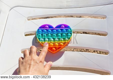 Colorful Antistress Sensory Toy. Pop It Kids Game. Outdoor Games For Children. Bright Multi-colored 