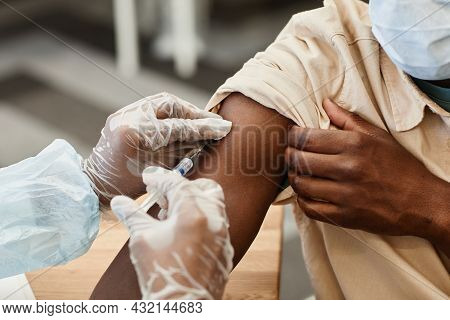 Close-up Image Of Nurse In Protective Gloves Giving Patient Injection Of Vaccine Against Coronavirus