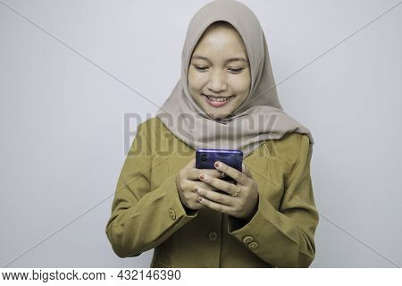 Happy Government Worker Women When Using A Smartphone. Pns Wearing Khaki Uniform.
