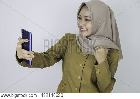 Smile Government Worker Women When Video Call Using A Smartphone. Pns Wearing Khaki Uniform.