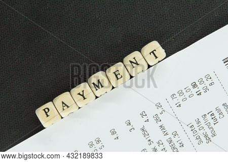 Malaysia, Kuala Terengganu 7 September 2021 : Receipt With The Word Payment On A Small Wooden Cube