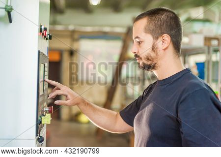 Close-up View Of Technician Work On Control Panel In Factory