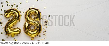 Golden Foil Balloon Number Twenty Eight. Birthday Or Anniversary Card With The Inscription 28. Gray 