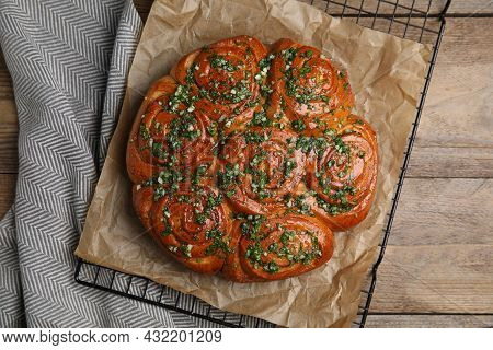 Traditional Ukrainian Garlic Bread With Herbs (pampushky) On Wooden Table, Flat Lay