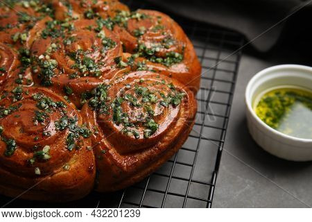 Traditional Ukrainian Garlic Bread With Herbs (pampushky) On Grey Table, Closeup. Space For Text