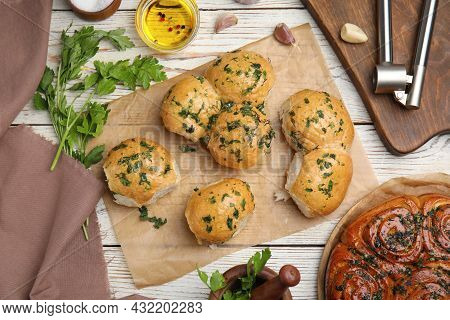 Traditional Ukrainian Bread (pampushky) With Garlic On White Wooden Table, Flat Lay