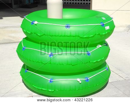 Three Green Pool Tubes