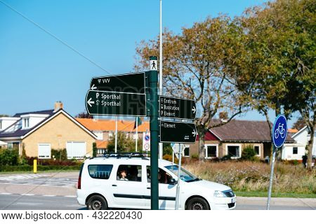 Netherlands - Aug 27, 2019: Street Sign Pole With Multiple Inscription To Sporthall, Center, Parking