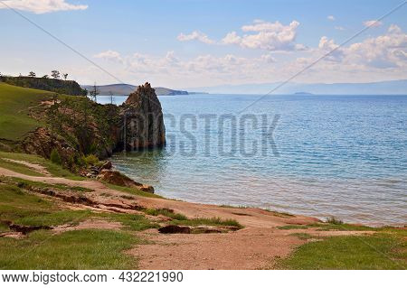 Lake Baikal, Olkhon Island On A Summer Day. Beautiful View Of The Khuzhir Bay Near The Shaman Rock.