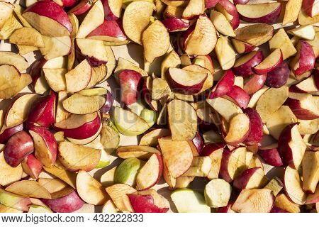 Drying Pieces Of Apples Lie On A Light Background.