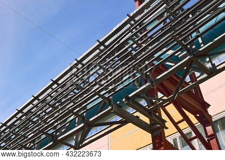 Cable Route On Steel And Reinforced Concrete Supports. Rows Of Parallel Power Cables Laid In Route F