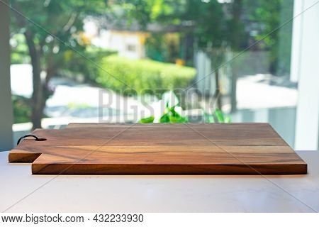 Wooden Cutting Board On A White Marble Surface Background