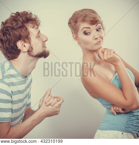 Conflicted Couple. Relationship Problem. Boyfriend Trying To Convince Girlfriend. Man Asking For For