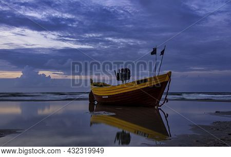 Sunset Over Baltic Sea With Fishing Boat On The Beach - Debki, Pomerania, Poland