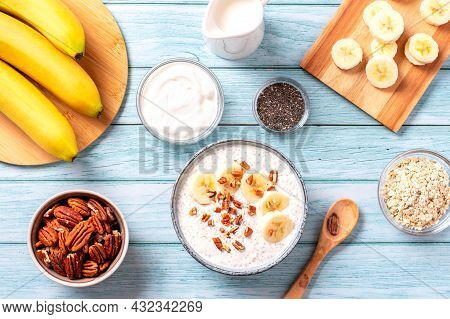 Banana And Pecan Nuts Overnight Oatmeal With Chia Seeds In Bowl, Rich In Protein Breakfast Or Snack