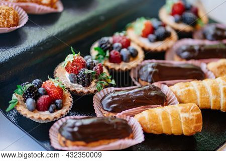 Assorted Cakes For The Holiday. Candy Bar. Sweet Birthday Treats.