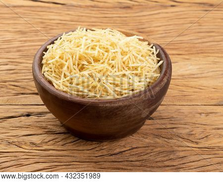 Potato Straw Or Shoestring Potato In A Bowl Over Wooden Table.