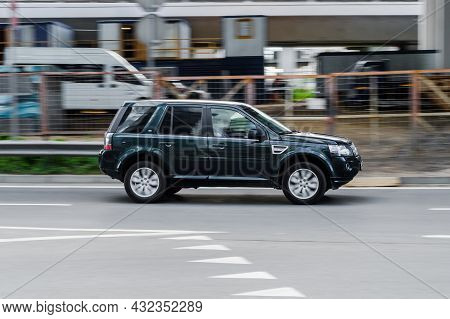Land Rover Freelander 2 Hse Td4 Driving On A City Road. Compliance With Speed Limits On Road Concept