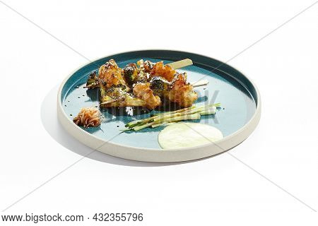 Vegetarian food - vegetables in skewers in teriyaki sauce. Grilled vegetables on bamboo stick in Japanese style. Vegan menu for asian restaurant. Eat less meat. Plant - based eating