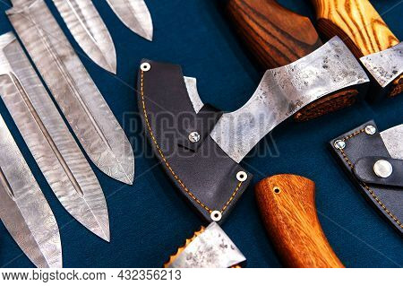 Axes And Knives In A Medieval Style. Trade In Decorative Weapons In The Store
