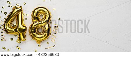 Golden Foil Balloon Number Forty Eight. Birthday Or Anniversary Card With The Inscription 48. Gray C