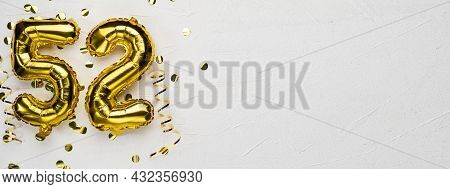 Golden Foil Balloon Number Fifty Two. Birthday Or Anniversary Card With The Inscription 52. Gray Con