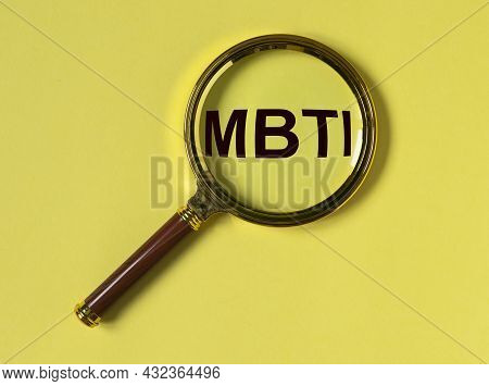 Mbti Test Of Personality Types. Acronym Through Magnifying Lens On Yellow Background. Psychology Con