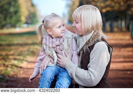 Scene Of Quiet Family Happiness Filiation And Love. Happy Caucasian Mother Holding Her Little Daught