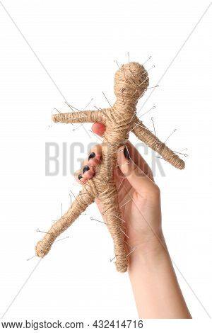 Woman Holding Voodoo Doll With Pins On White Background, Closeup