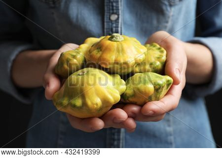 Woman With Fresh Ripe Pattypan Squashes On Black Background, Closeup