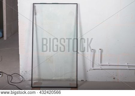 The Double-glazed Window Stands On The Floor Before Being Installed In The Window Frame.