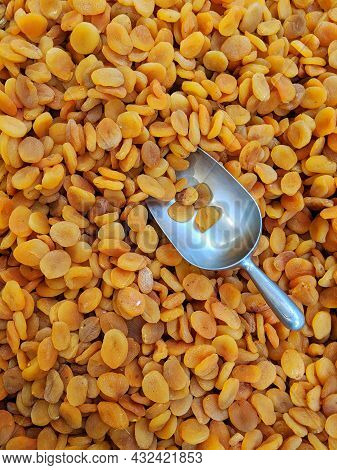 Dried Apricots With A Large Metal Spoon / Scoop Ready To Be Sold Unpackaged To The Environmentally C