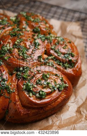 Traditional Ukrainian Garlic Bread With Herbs (pampushky) On Parchment, Closeup